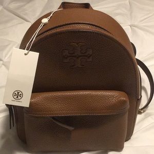 Beautiful brand new Tory backpack with front zip pocket